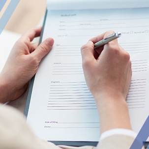 person filling out medical paperwork